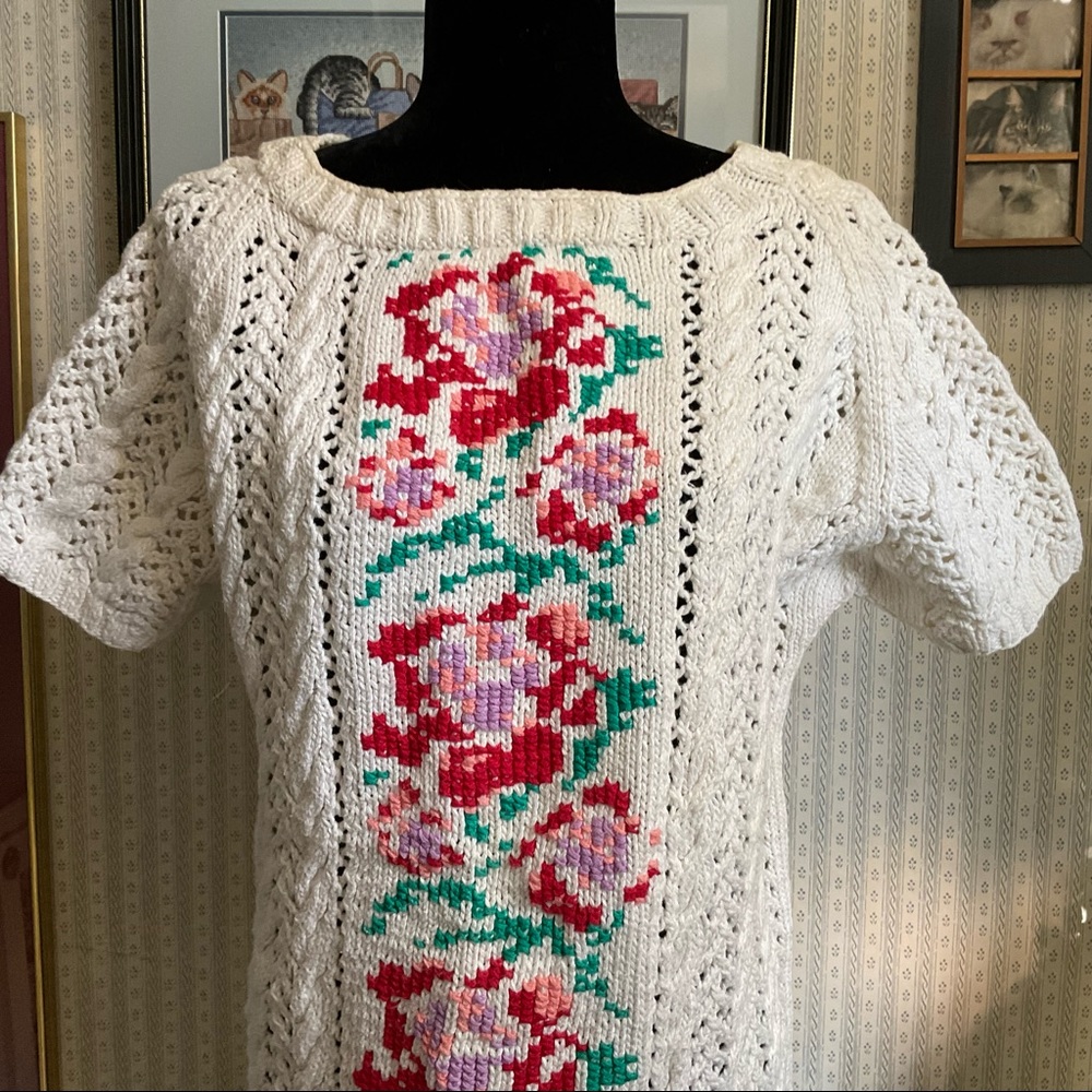Hand knitted sweater with cross stitch embellishment